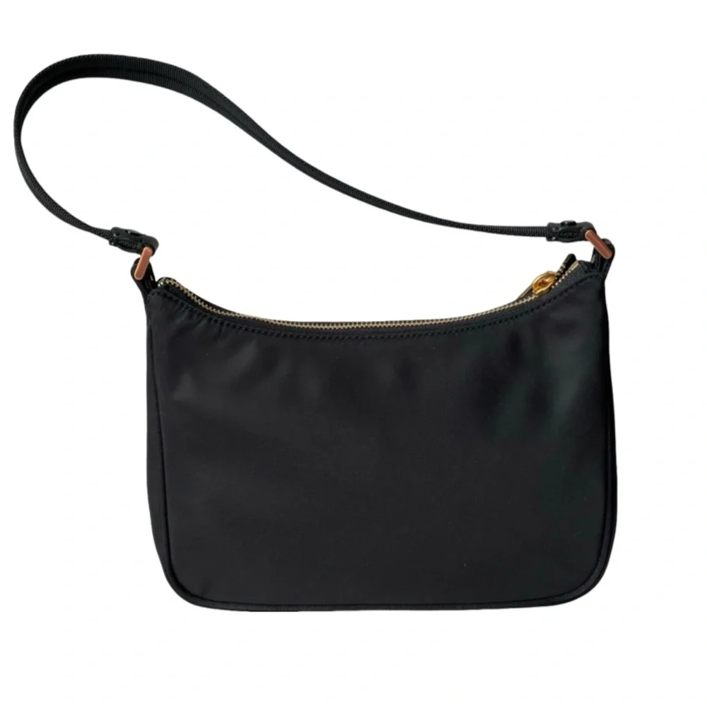 Kate Spade Embellished durable woven nylon with leather trim Matte lining